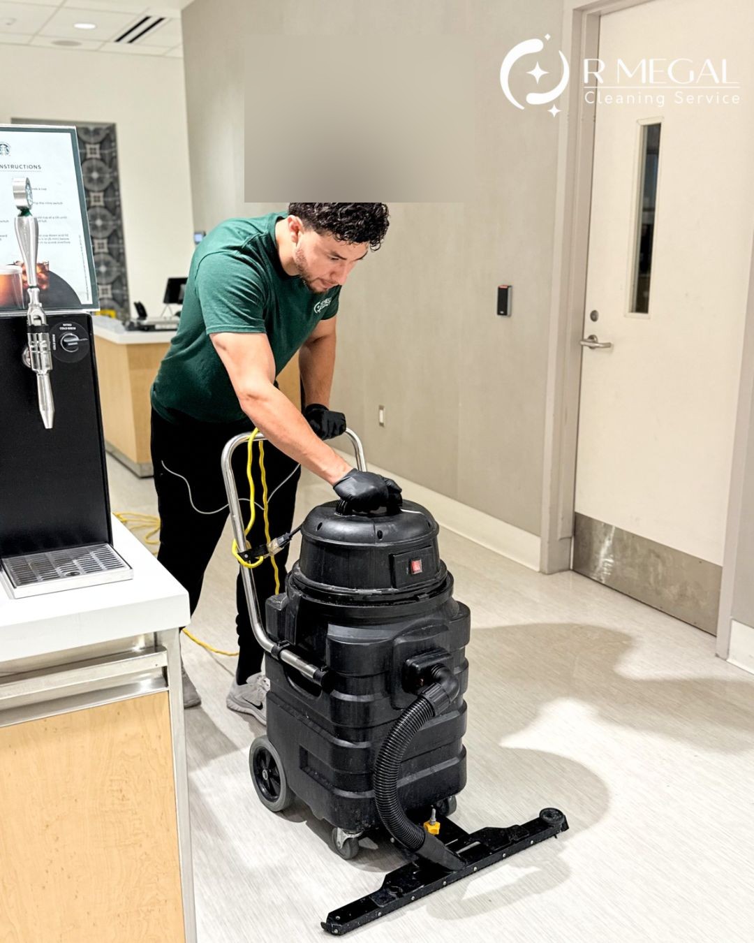 R Megal technician cleaning with professional equipment