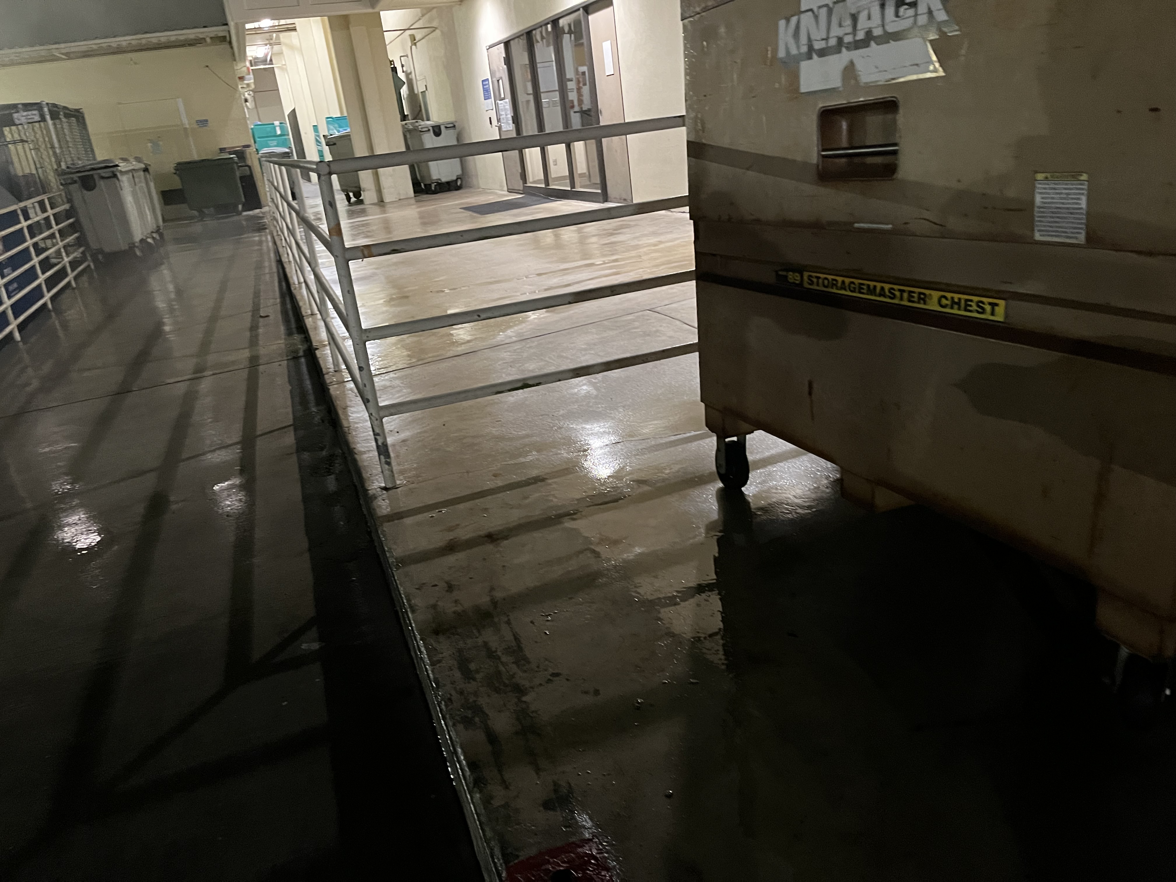 Night pressure washing on commercial loading dock